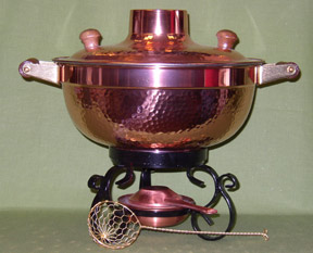 Mongolian fire pot - cook meat, fish, and vegetables in this broth filled vessel then enjoy the broth as a soup